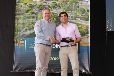 Figure 4. Ron Hochstein presents Otto Sonnenholzner with a gift during the inauguration ceremony at Fruta del Norte. (CNW Group/Lundin Gold Inc.) Figure 4. Ron Hochstein presents Otto Sonnenholzner with a gift during the inauguration ceremony at Fruta del Norte. (CNW Group/Lundin Gold Inc.)
